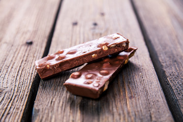 Chocolate with hazelnuts candy as background