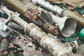 remnants of shells anti-tank rocket propelled grenade launcher and High Mobility Artillery Rocket...