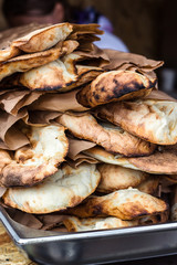 Lavash, Bakery Products fresh pastry sells pita market wheat tortillas close-up Caucasian kitchen Lavash Pita or Arabic bread traditional healthy eastern Georgian flatbreads paper bags country Georgia