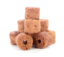 Crunchy corn and chocolate snacks on a white background.