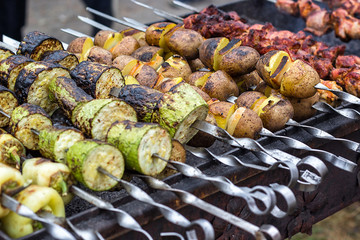 Skewered vegetables green zucchini courgettes cucumber peppers preparing barbecue grill charcoal Grilled roasted fried slices covered beautiful crust Mediterranean cuisine delicious food bbq party