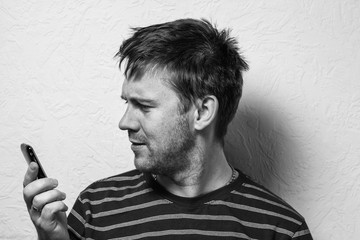 Close up of a funny young man. The collage of young man with different emotion. emotional card. Black-and-white photo.