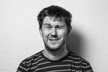 Close up of a funny young man. The collage of young man with different emotion. emotional card. Black-and-white photo.