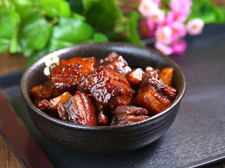 A large bowl of Braised pork in brown sauce