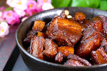 A large bowl of Braised pork in brown sauce