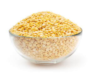 Bowl of yellow lentils isolated on white background with clipping path