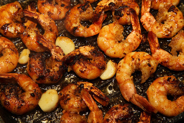 Royal shrimps on a grill with garlic