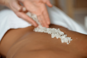 Young beautiful girl relaxing in spa salon.