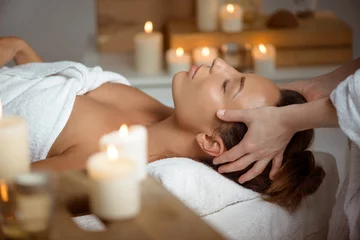 Stickers pour porte Salon de massage Young beautiful girl having face massage relaxing in spa salon.