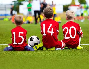 Children Soccer Football Players. Children Football Team. Young Boys Play Football Game on Sports Stadium
