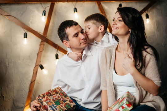 happy young family in Christmas decorations