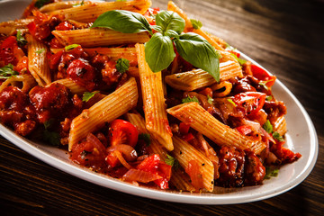 Penne with meat, tomato sauce and vegetables