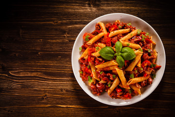 Penne with meat, tomato sauce and vegetables