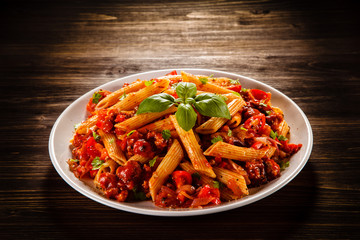 Penne with meat, tomato sauce and vegetables