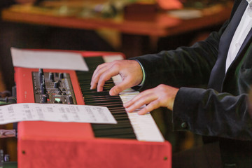 Hands and synthesizer
