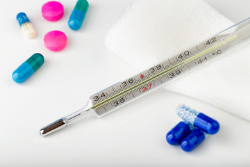 Thermometer with blue pills