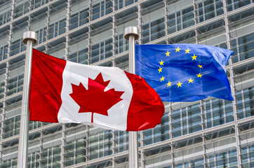 Canadian and European flags waving in the wind (montage)