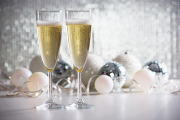 Champagne glasses and christmas balls
