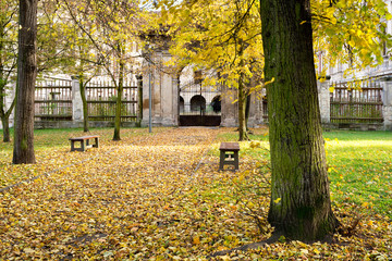 Autumn park with a historic building