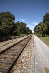 Obraz premium Florida USA - October 2016 - Railroad track passing through Florida countryside