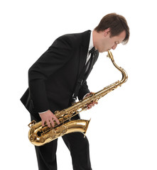 Naklejka premium Saxophonist in a tuxedo plays music on sax.