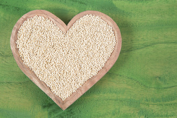 Quinoa seeds in wooden bowl