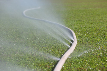 water leaking from hole in a hose