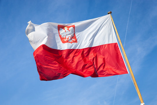 Polish national flag in the sky.