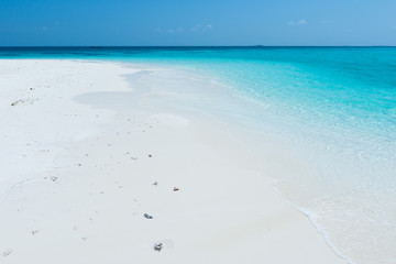 Maldive Island. White sand tropical beach. Relaxed summer day.