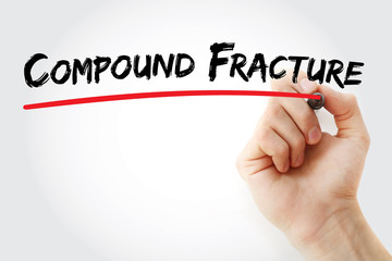 Hand writing Compound fracture with marker, concept background