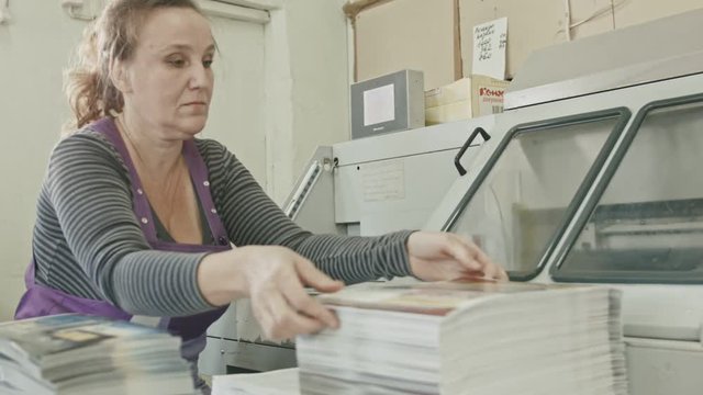 Polygraph printing process - a woman's manual labor - making magazine
