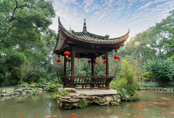 chinese ancient pavilion with golden fish