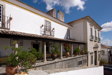 Big ceramic pots between the columns at the terrace of old house