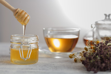 Cup of herbal tea with wild flowers and various herbs