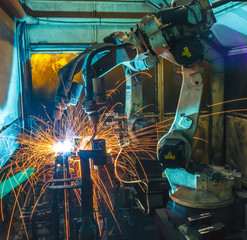Robots welding movement in a car production factory 
