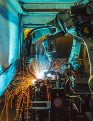Robots welding movement in a car production factory 
