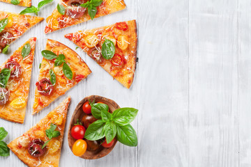 Pizza with tomatoes, mozzarella and basil