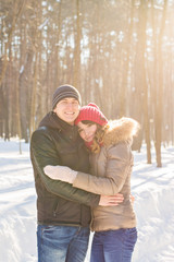 people, season, love and leisure concept - happy couple outdoors in winter