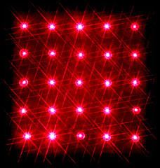 Array of red semiconductor lasers isolated on black background