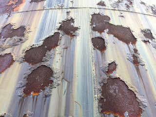 Cracked and peeled metal with rust texture