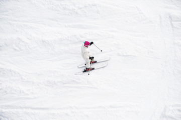 Fototapeta na wymiar Skier running down the slope. 