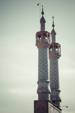 Mosque of Yazd in Iran. The mosque is crowned by a pair of minarets.