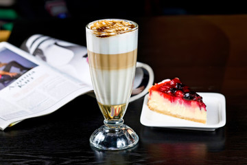 Latte Macchiato In Glass Cup On The Wooden Table