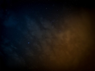 Stars and Cloudy in sky on blue and orange tone