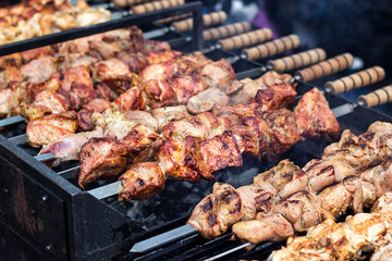 Marinated shashlik preparing on a barbecue grill over charcoal. Shashlik or Shish kebab popular in Eastern Europe. Shashlyk (skewered meat) was originally made of lamb. Roast Beef Kebabs On BBQ Grill.