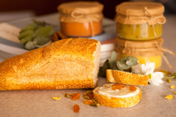 Sweet apricot jam, banana jam and strawberry jam in glass jars a
