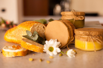 Sweet fruit jam in glass jars are on the table
