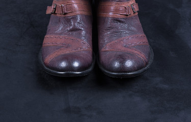 men's leather vintage shoes isolated on a black background