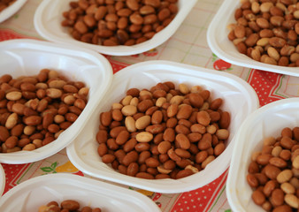 plastic plates filled with boiled beans during the feast