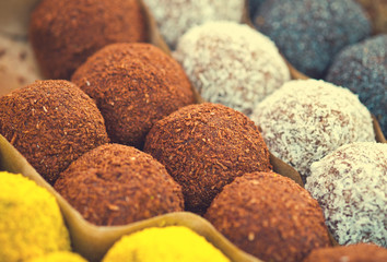 Colorful healthy homemade candies with nuts, dry fruits and spices